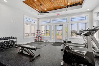 24-Hour fitness center with cardio & strength training equipment